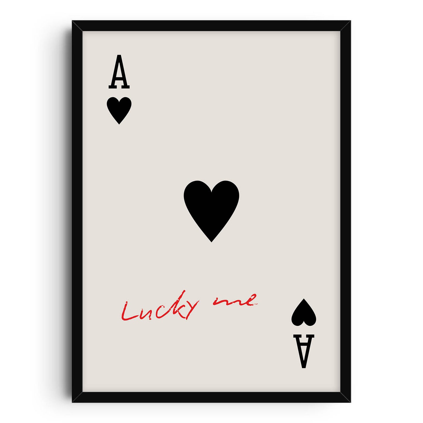 Minimalist art print of the Ace of Hearts playing card with 'Lucky me' handwritten in red beneath the central heart symbol, on a beige background.