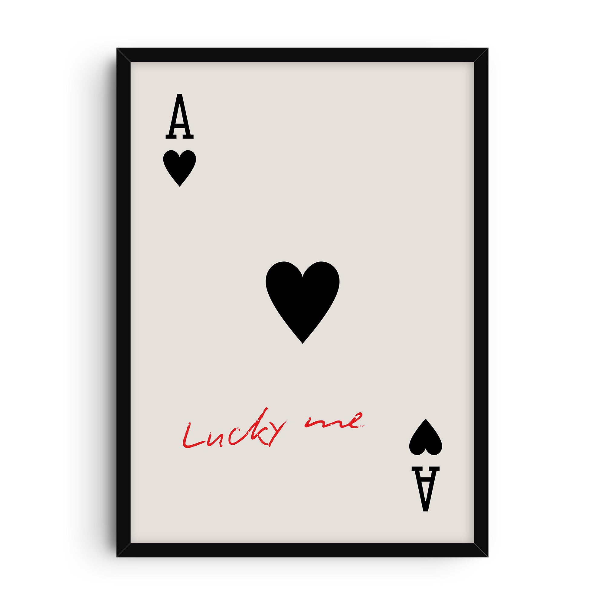 Minimalist art print of the Ace of Hearts playing card with large black heart symbol and handwritten red text “Lucky me” across the card on a light background.
