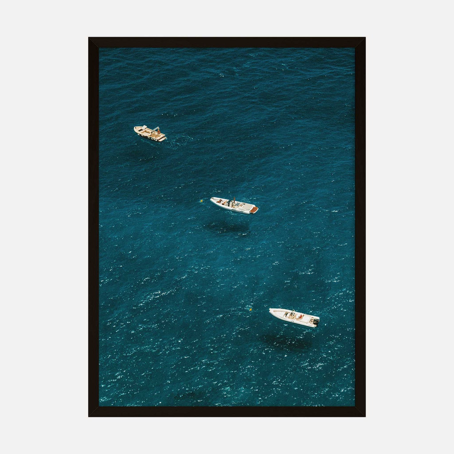 Aerial view art print of boats floating on the blue waters of the Amalfi Coast in Italy.