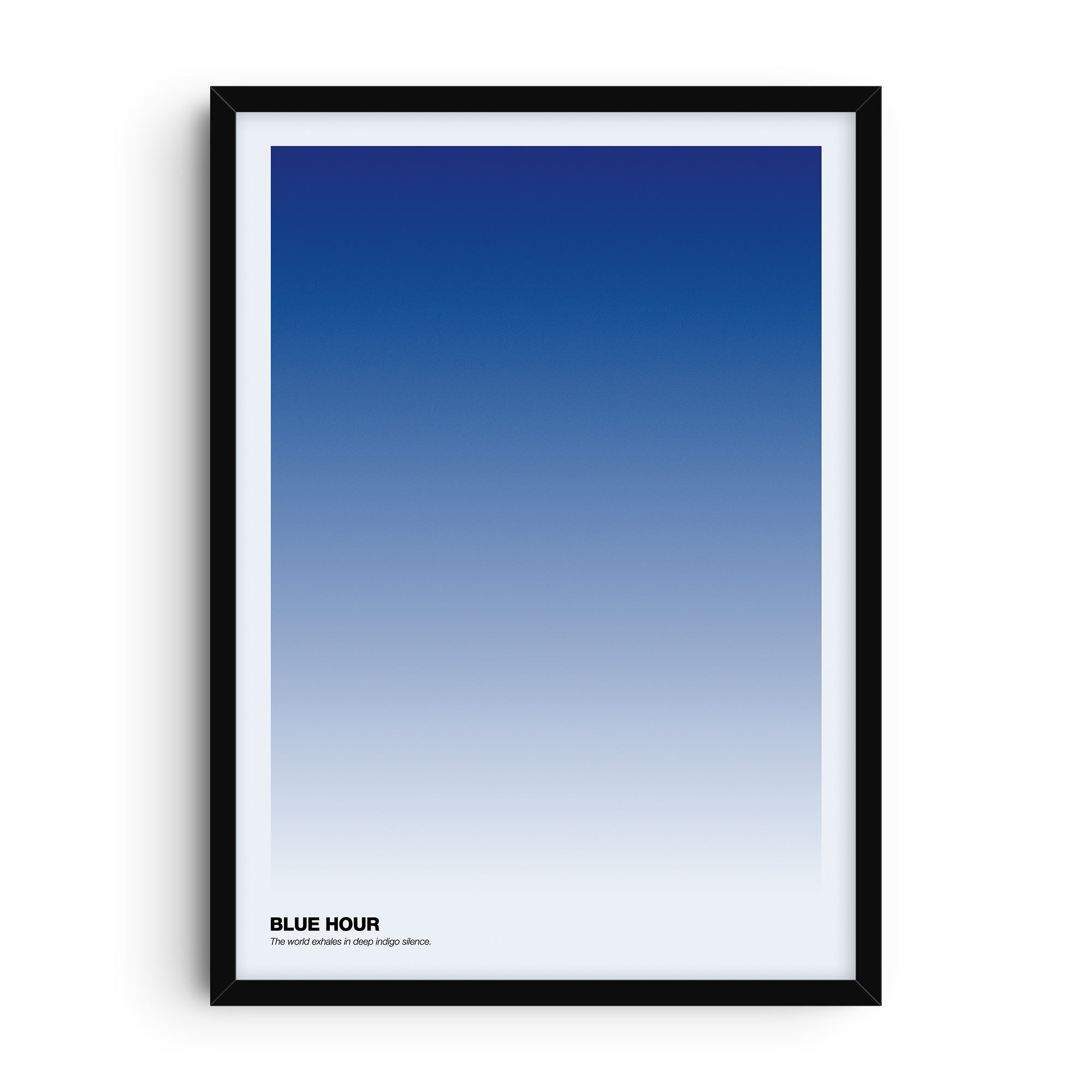 Minimalist art print titled Blue Hour, featuring a smooth indigo gradient fading from deep blue at the top to pale tones at the bottom. In the lower left corner, text reads “Blue Hour – The world exhales in deep indigo silence.” A contemplative and modern gradient wall art design.