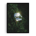 Surreal art print of a chrome monobloc chair reflecting sunlight in a grassy field, minimalist digital render with cinematic lighting, modern wall decor poster.