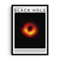 Art print featuring the first photograph of a black hole, showing a glowing orange ring of light against a black background. The design includes bold text reading “First Image of a Black Hole” at the top and a descriptive passage at the bottom, celebrating this milestone in astronomy and science history.
