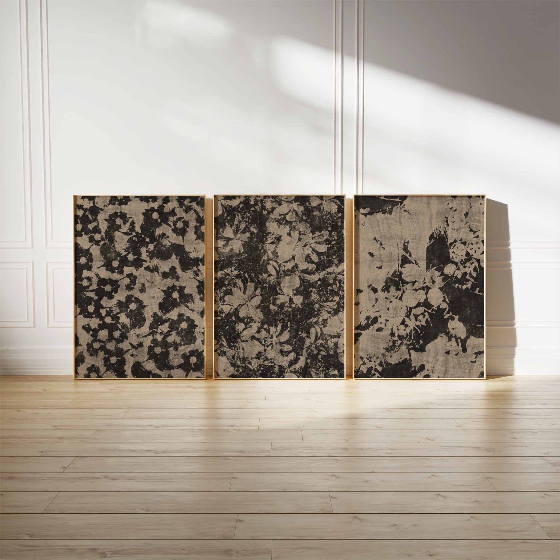 A set of three rustic floral pattern art prints in earthy tones, each featuring a unique abstract botanical design, framed and displayed against a minimalist background.