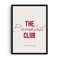 Minimalist typography art print with the phrase “The Breakfast Club” in bold red letters, a handwritten script overlay, and the text “Meet me at the table” below on a light background.