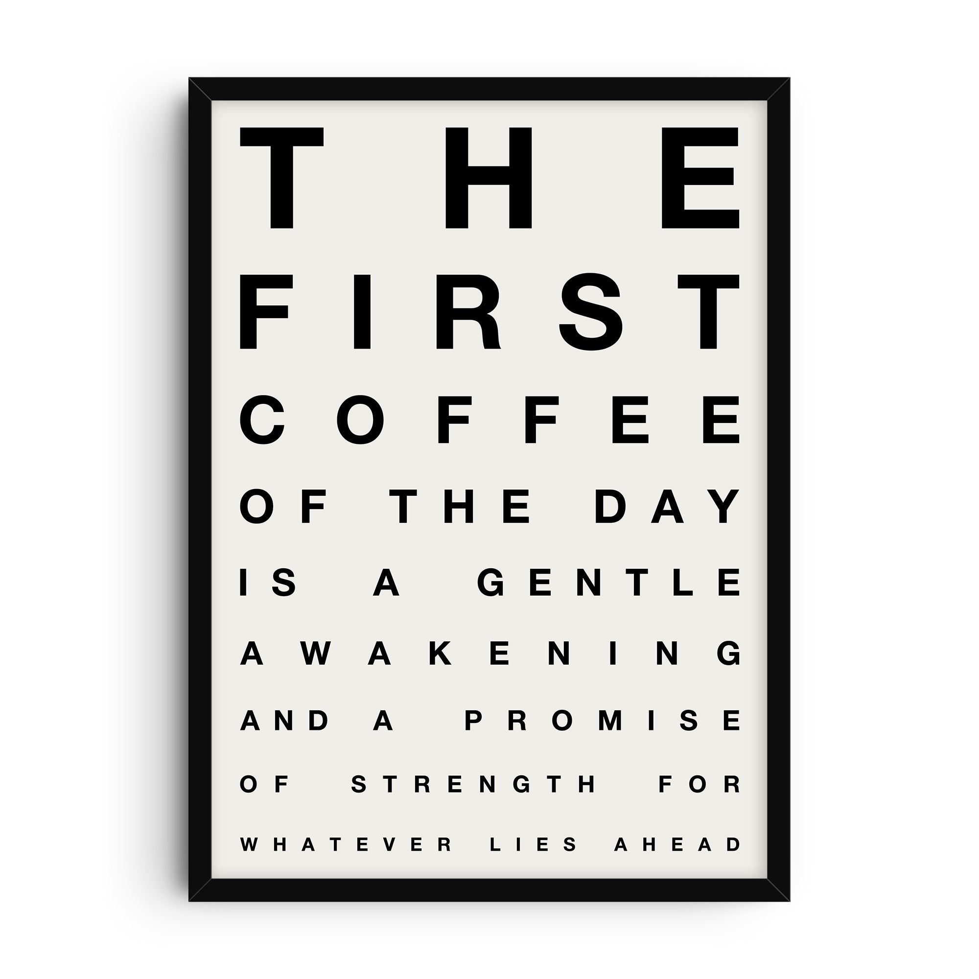 Minimalist typography art print styled like an eye chart with the phrase “The first coffee of the day is a gentle awakening and a promise of strength for whatever lies ahead” in bold black letters on a light background.